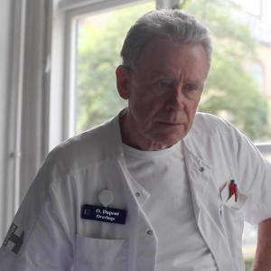 Ole Dupont as Chief Doctor in Komik  Tragedie