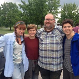 Lauren Holly, Lucas Carroll, Bill Chott, and Zach Louis on the set of the film 'Marshall the Miracle Dog'.