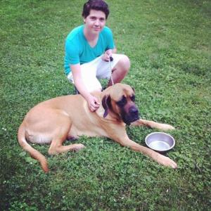 Zach Louis takes a break with his costar Ben on the set of Marshall the Miracle Dog
