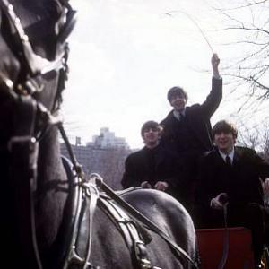 The Beatles  Ringo Starr Paul McCartney John Lennon on a horse carriage ride Paul the only one standing