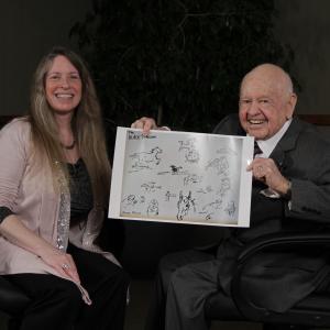 Presenting Mickey Rooney with a gift: sketches from The Black Stallion by artist Karen Mclain (2 Nov 2011)