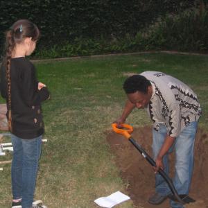 Eddie Griffin running lines with Natalie Miranda and practicing digging a grave prior to shooting a scene on the set of 