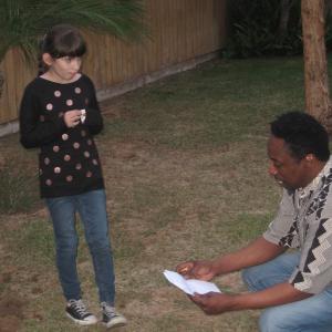 Natalie Miranda running lines with Eddie Griffin on the set of Last Supper prior to shooting a scene