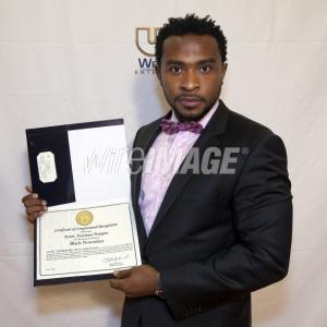 Enyinna Nwigwe with his certificate of congressional recognition from the United States Congress
