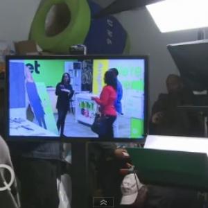 Nimi Adokiye on the commercial set of CRICKET with Queen Latifah