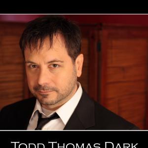 Todd Thomas Dark 2011 headshot loose tie jazz man? reporter? lawyer? detective?