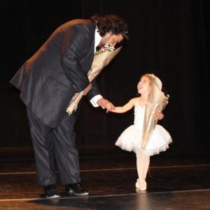 Director Gabriel Schmidt greets little ballerina Victoria Schmidt