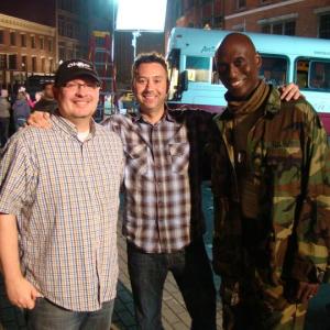 Zach O'Brien, Shane O'Brien, and Lance Reddick on the set of 