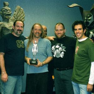 LR Howard Berger Greg Nicotero and Bob Kurtzman of KNB Efx with Eli Roth and the 2002 Sitges Film Festival trophy for best makeup effects