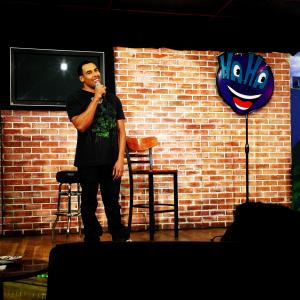 Matthew Jordan performing standup at the HaHa Comedy Club