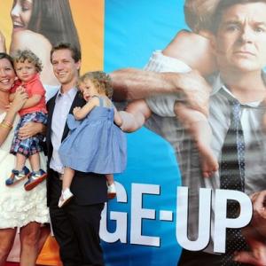 Castmember Luke Bain (2nd L) and his twin sister Lauren (R) are held by their parents Missy and Matthew Bain at the world premiere of 'The Change-Up' at the Village Theatre in Los Angeles, California on August 1, 2011.