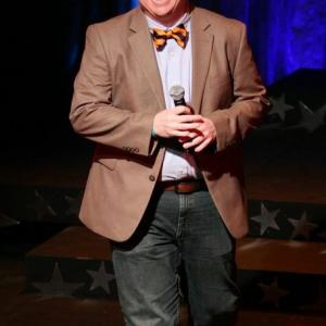 Justin Barnette doing stand-up at the West Side YMCA's 2013 benefit.