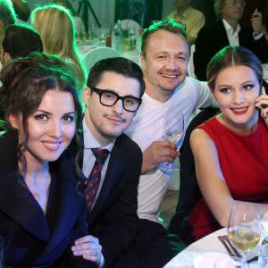 LR Actress Alesa Kocher producer Josh Wood a guest C and Duma deputy actress Maria Kozhevnikova R attends the 35th Moscow International Film Festival After Party on the opening night on June 20 2013 in Moscow Russia