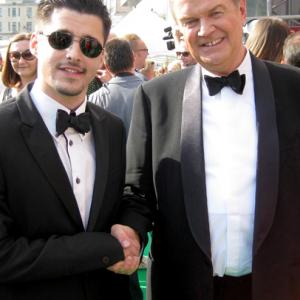 LR Producer Josh Wood with director John Madden arrive at the premiere of the Debt during the 33d Moscow International Film Festival at Pushkinskiy Theatre on June 30 2011 in Moscow Russia