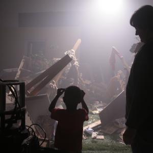 Storm City 3D Discussing a scene of devastation with the young star