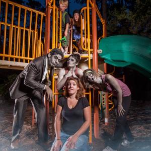 Writer/Producer Courtney Sandifer surrounded by zombies and kids from the 