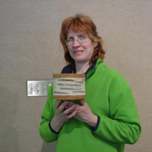 LindaLou Lagod the Alaskan actress, holding an Alaskan birchbark basket.