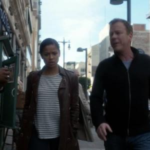 Still of Kiefer Sutherland and Gugu MbathaRaw in Touch 2012