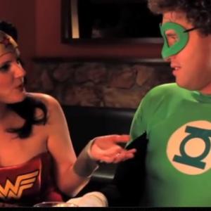 Liz Stewart as Wonder Woman and TJ Miller as Green Lantern in 