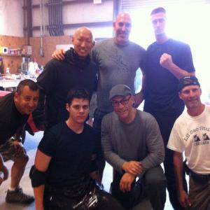 Lloyd Pitts along side Jean-Claude Van Damme, director John Hyams, and some of the Dragon Eyes Stunt team.