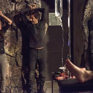 Still of Henry Ian Cusick Paige Turco and Lindsey Morgan in The 100 2014
