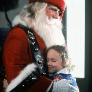 Still of Thora Birch and Leslie Nielsen in All I Want for Christmas 1991
