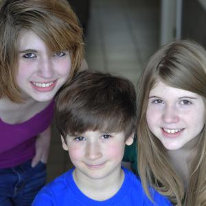 Taran and his sisters. Meagan Hall and Caitlin Hall