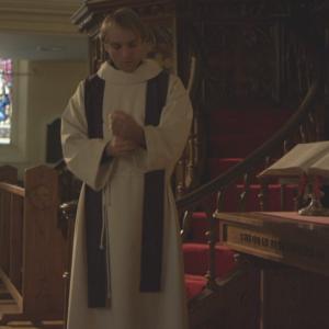 The Priest prepares to hear confessions in Forgive Me