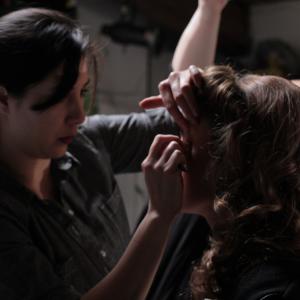 Cole Phoenix and makeup artist Amber Crombach getting ready for promotional photoshoot