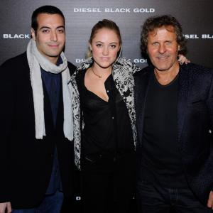 NEW YORK NY  SEPTEMBER 11 LR Mohammed Al Turki Maika Monroe and Diesel founder Renzo Rosso attend the Diesel Black Gold 2013 MercedesBenz Fashion Week Show at 15th Street At The West Side Highway on September 11 2012 in New York City