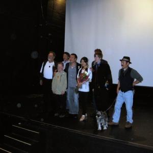 Casr and Director on stage at premier A DAY