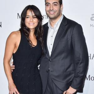 Michelle Rodriguez and Mohammed Al Turki arrive at amfAR Milano 2015 at La Permanente on September 26, 2015 in Milan, Italy.