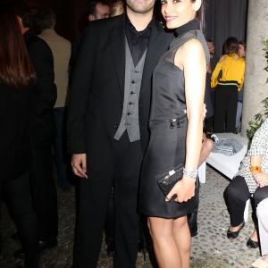 MILAN ITALY  SEPTEMBER 20 Mohammed Al Turki and Freida Pinto attend the Salvatore Ferragamo Boutique Opening as part of Milan Fashion Week Womenswear SpringSummer 2014 on September 20 2013 in Milan Italy