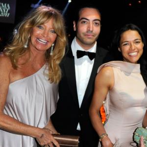 ANTIBES, FRANCE - MAY 19: Goldie Hawn, Mohammed Al Turki, and Michelle Rodriguez attend amfAR's Cinema Against AIDS Gala during the 64th Annual Cannes Film Festival at Hotel Du Cap on May 19, 2011 in Antibes, France.