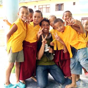 Alex Kruz with young Tibetan Buddhist Monks during filming of Blind Faith Documentary by Alex Lora