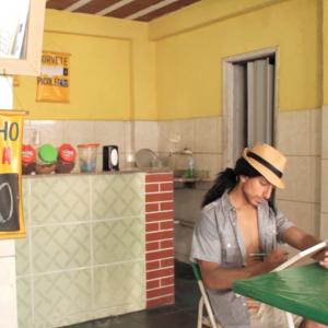 Artist João Freire (Alex Kruz) at the ice cream shop in one of the poorest slums in Rio de Janeiro, Brasil
