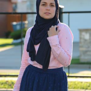 Mariam Sobh without makeup modeling skirt from Haute Hijab