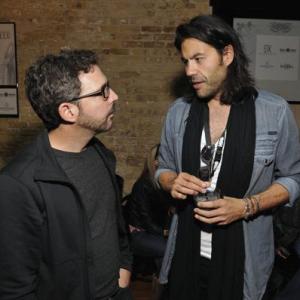 Producer Lucan Toh right speaks with a guest during the Before I Disappear SxSw premier party at Supper Suite By STK hosted by Blue Moon Brewing Co on Monday March 10 2014 in Austin Texas