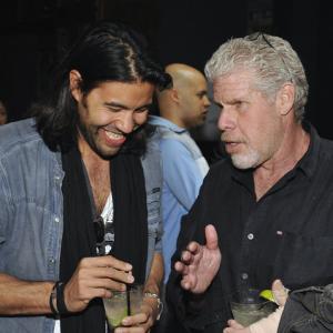 Producer Lucan Toh left speaks with actor Ron Perlman during the Before I Disappear SxSw premier party at Supper Suite By STK hosted by Blue Moon Brewing Co on Monday March 10 2014 in Austin Texas