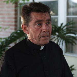 Anthony B Cohen as The Priest in The Human Race