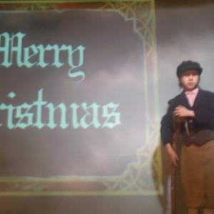 Robert Szot as Tiny Tim Cratchit in Ebenezer Scrooge
