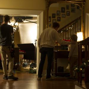 Director Brandon Kapelow prepares for a take with Oliver Bell on the set of Blessed Our Father