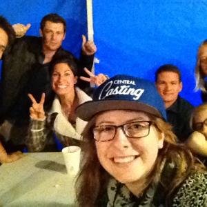 Carly on the set with the Background Actors she cast in a show