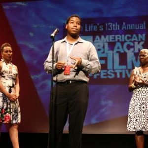 Kiel Adrian Scott on stage at the 2009 American Black Film Festival accepting the Award for the HBO Short Film Competition