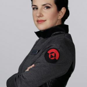 Helen Johns as Officer Emily Roarke in Space Janitors