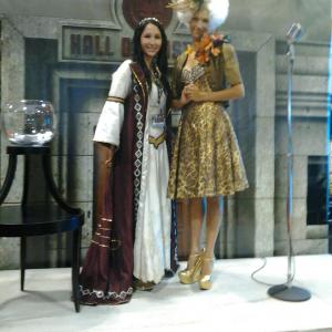Sarah Winstanley for Medieval Times as Princess Catalina with a Capitol citizen from The Hunger Games at Torontos 2013 Fan Expo