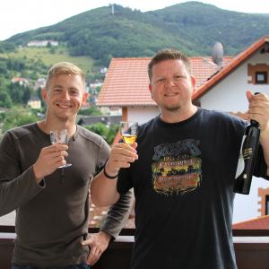 Larry A Burns Jr and Christopher Dearborn drinking Sciacchetra on Larrys balcony in Germany
