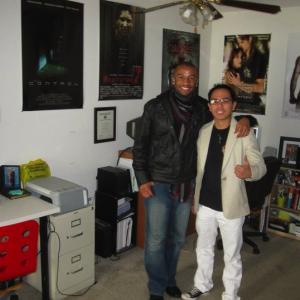 Rey and writerdirector Justin Chambers with his previous films on the wall