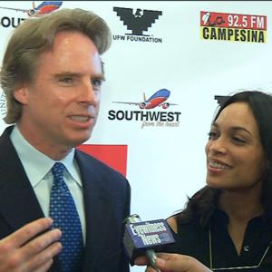 Jack Holmes and Rosario Dawson speak to a reporter on the red carpet at the Bakersfield CA premiere screening of Cesar Chavez