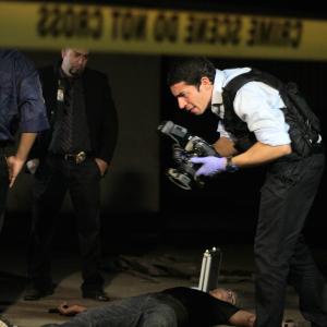 A coroner investigates the scene of the crime, in the film, Creatures.